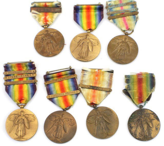 WW1 US MILITARY MEDAL LOT OF 7 VICTORY MEDALS: WW1 US MILITARY MEDAL LOT OF 7 VICTORY MEDALS WW1 Victory medals with bars for Escort, Champagne, Aisne, Defensive sector, Meuse and France. Size: Full size Condition: Fair/good EST. 100-200
