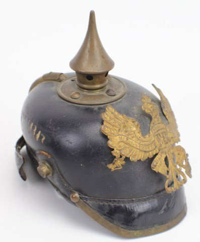 WWI PRUSSIAN LEATHER PICKELHAUBE: A leather Pickelhaube helmet with brass fittings. Some misshaping and stitching faults. Condition: See description Est$ 100 - 300