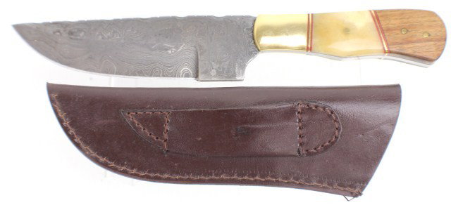 10.75" CUSTOM MADE STAG HANDLE KNIFE: 6" Damascus steel blade, with brass, horn and wood scales. Contained in a hand made leather sheath. Condition: almost as new.