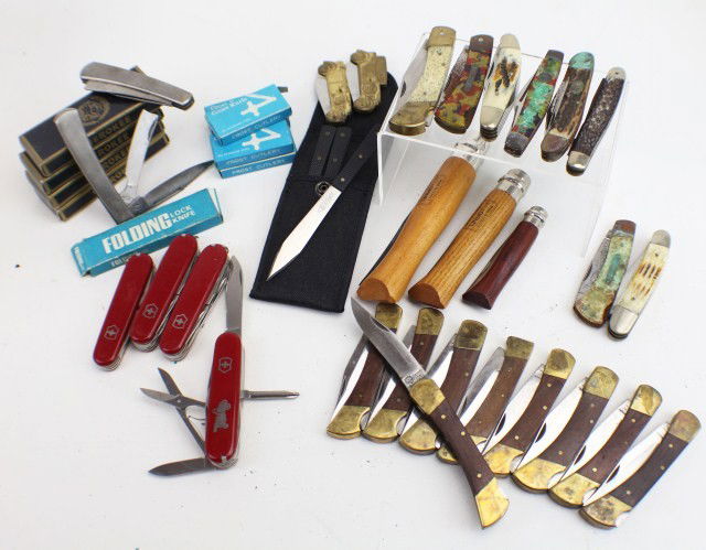 LARGE LOT OF FOLDING AND UTILITY KNIVES: LARGE LOT OF FOLDING AND UTILITY KNIVES. Lot of 40 assorted folding and utility knives to include 3 French Opinel knives, 5 Cherokee blades, 4 Swiss army knives, a set of 3 throwing knives and more. C