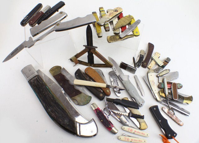 LARGE LOT OF FOLDING AND POCKET KNIVES: LARGE LOT OF FOLDING AND POCKET KNIVES. Lot of 45 assorted pocket and folding knives varying in color, size and condition. Includes an oversized folding knife, some German made blades, 3 explorer kniv