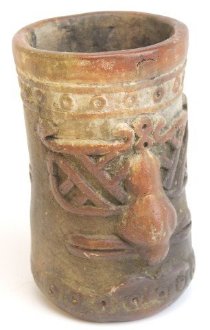 MAYAN CYLINDER VASE WITH FACE IN RELIEF: MAYAN CYLINDER VASE WITH FACE IN RELIEF Tall Mayan clay vase with a face carved in the front and ceremonial dancing design on the back. Size: 7.25 x 4.5"