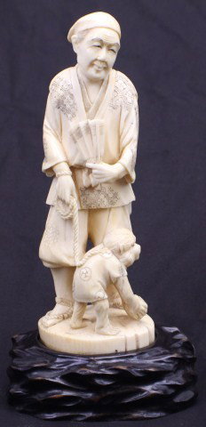 CARVED CHINESE ELEPHANT IVORY OLD GENTLEMAN: CARVED CHINESE ELEPHANT IVORY OLD GENTLEMAN Very detailed Chinese carving of a man and a monkey. The man is depicted holding a folding fan in his left hand and a leash leading to the monkey in his rig