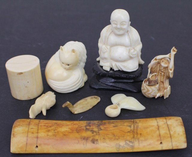 JAPANESE CARVED ELEPHANT IVORY NETSUKE OKIMONO LOT: JAPANESE CARVED ELEPHANT IVORY NETSUKE OKIMONO LOT Elephant ivory carvings including a Hotei okimono on a dark wood stand (almost 3" tall including the wood base). A carved cat netsuke, signed. An old