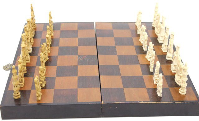 CHINESE IVORY CHESS SET: CHINESE IVORY CHESS SET Hand carved Chinese elephant ivory chess set. Opponent set determined by stain on ivory. Size: Pawn 1 3/4" - Rook 3"