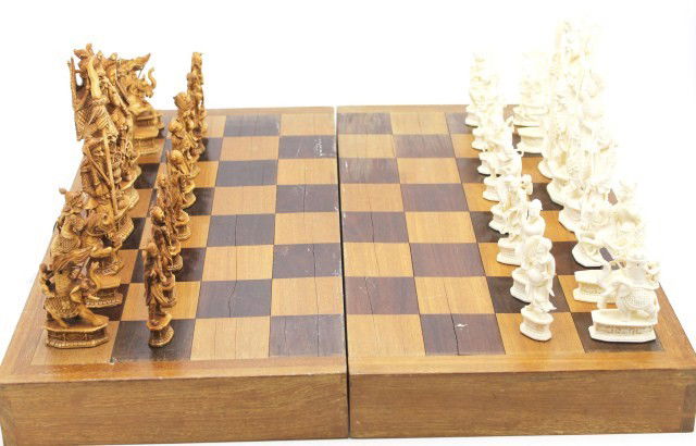 LARGE CHINESE ELEPHANT IVORY CHESS SET: LARGE CHINESE ELEPHANT IVORY CHESS SET Complete intricately carved elephant ivory chess set. Chinese in origin and design. Sets are distinguished by stained and white ivory as well as a large variety