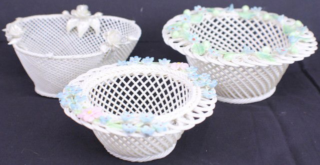 BELLEEK PORCELAIN BASKETS: BELLEEK PORCELAIN BASKETS 3 Belleek Lace Baskets.1 white lace bowl with blue and pink floral design around rim, features the 13th mark of Belleek's age. 1 silver lace bowl with 3 silver roses on rim.