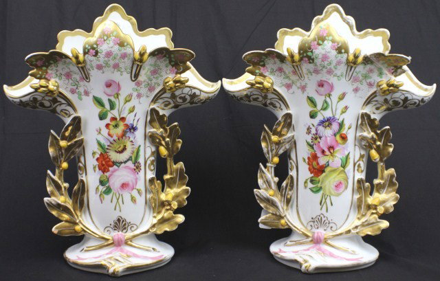 PAIR OF OLD PARIS HAND PAINTED PORCELAIN VASES: PAIR OF OLD PARIS HAND PAINTED PORCELAIN VASES Beautiful pair of Old Paris porcelain garniture vases. Hand painted floral central reserve with ornate foliate gilt handles and scalloped gilt lip. Size: