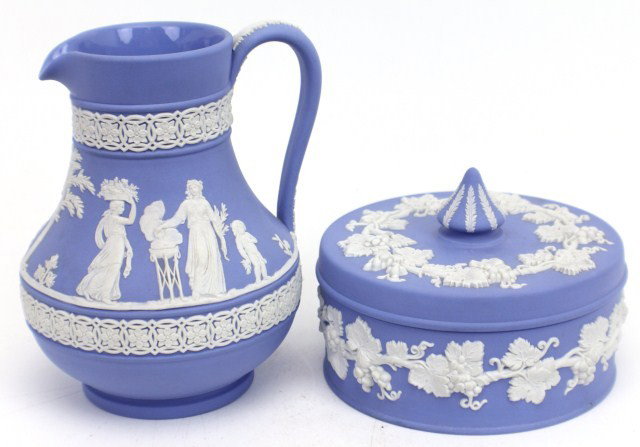 2 BLUE JASPER WEDGEWOOD PIECES: 2 BLUE JASPER WEDGEWOOD PIECES Two light blue jasper wedgewood pieces to include a cream pitcher and a trinket dish. Roman figurine decorations on cream pitcher as well as production stamp "Wedgewood 