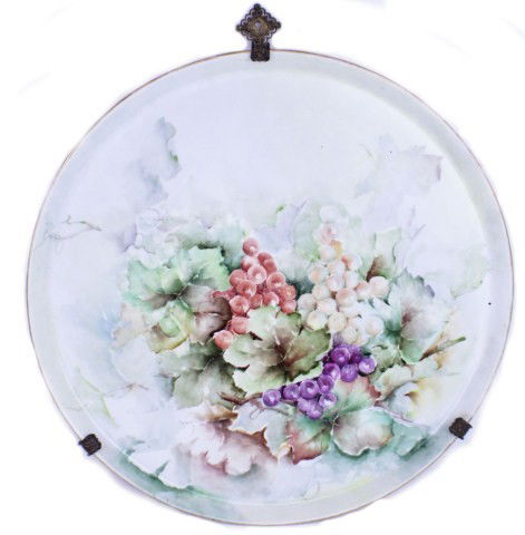 HANDPAINTED PORCELAIN LIMOGE SERVING TRAY: HANDPAINTED PORCELAIN LIMOGE SERVING TRAY Large Limoge porcelain serving tray with hand painted fruit decor. Mounted on a brass wall hanging brace. Size: D: 18"