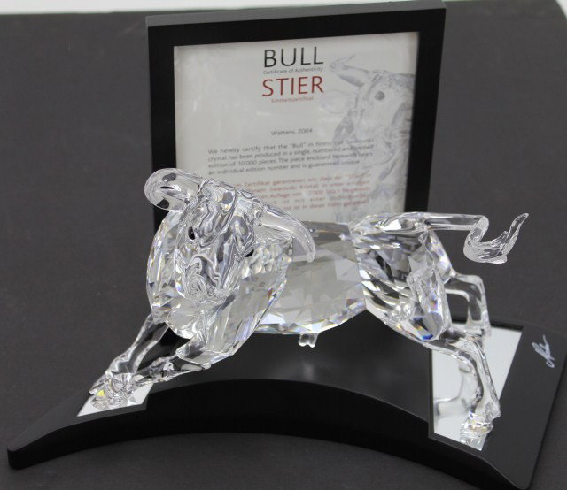 2004 SWAROVSKI CRYSTAL LIMITED EDITION "THE BULL": 2004 SWAROVSKI CRYSTAL LIMITED EDITION "THE BULL" Swarovski Crystal limited edition "Bull". Numbered 3,514/10,000. Designed by Adi Stocker in 2004. In original Swarovski lockable case with stand, glov