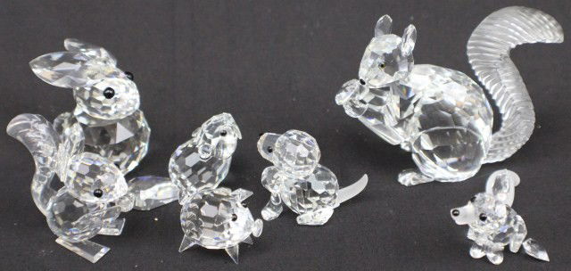 LOT 7 SWAROVSKI CRYSTAL ANIMAL FIGURES: LOT 7 SWAROVSKI CRYSTAL ANIMAL FIGURES Includes: Retired sitting baby beaver, "Woodland Friends" Fox (tail and ear are detached but present), retired rabbit, retired mini pig with crystal disc tail, S