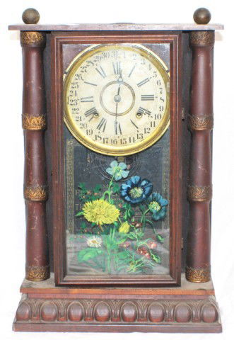 EUREKA EIGHT DAY CALENDER WALL CLOCK: EUREKA EIGHT DAY CALENDER WALL CLOCK Eureka Eight Day Calendar Wall Clock glass front with reverse painting of flowers on glass. Measures 23 x 15" and has original pendulum and key. In working order b