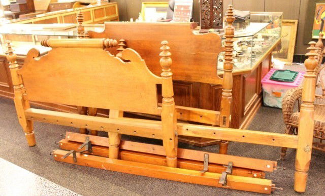 2 ANTIQUE BED FRAMES: 2 ANTIQUE BED FRAMES A queen size bed complete with head and footboard. The legs are wide and sturdy with a decorative conical design at the ends. The second bed is a full size and includes a headboar