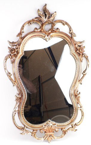 ORNATE SYROCO MIRROR AND BRASS WALL SCONCES: ORNATE SYROCO MIRROR AND BRASS WALL SCONCES Gilt gold colored wall mirror by Syroco and a pair of brass candle wall sconces that are complete with candle snuffers. Size: Mirror H: 31" W: 19 1/3" Sconc