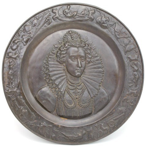 CAST IRON WALL MEDALLION OF ELIZABETH 1ST: CAST IRON WALL MEDALLION OF ELIZABETH 1ST 22 inch diameter. Cast iron wall medallion with the bust of Queen Elizabeth I surrounded by a border consisting of military regalia such as spears, cannons, a