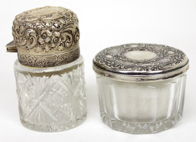 SET OF GLASS JARS WITH TOWLE STERLING SILVER LIDS: SET OF GLASS JARS WITH TOWLE STERLING SILVER LIDS Smaller lidded jar is marked Towle sterling and is mirrored on the underside. The larger of the two is monogrammed on the top and marked sterling unde