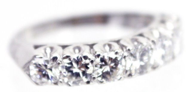 LADIES 14K WHITE GOLD DIAMOND WEDDING BAND: LADIES 14K WHITE GOLD DIAMOND WEDDING BAND 14K white gold wedding band with 7 round brilliant cut diamonds ranging in size from 0.19 ct to 0.25 ct each. Clarity ranges from VVS-2 to SI-1 and color ran