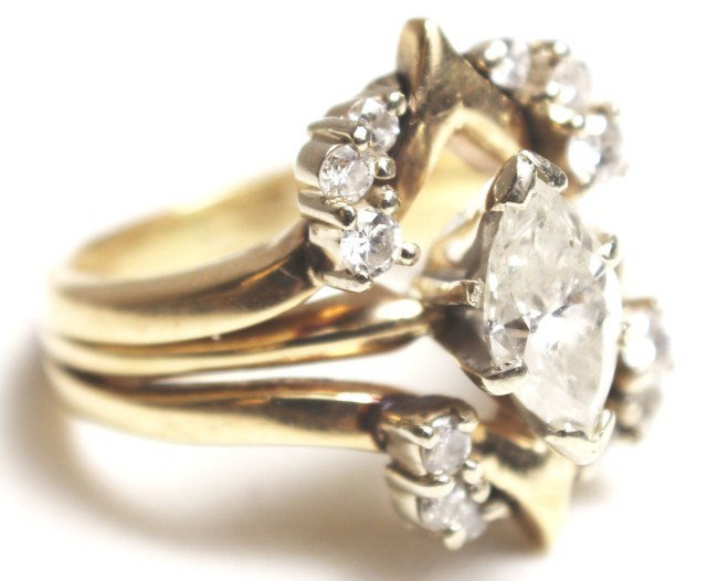 LADIES 14K GOLD 1.3 CT DIAMOND RING: LADIES 14K GOLD 1.3 CT DIAMOND RING A beautiful ladies diamond wedding set. Solitaire marquise diamond of approximately 0.5 ct of I clarity and J color. The marquise diamond is accented with an enhanc