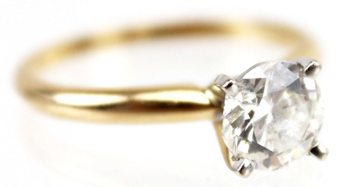 1 CT SOLITAIRE DIAMOND ENGAGEMENT RING: 1 CT SOLITAIRE DIAMOND ENGAGEMENT RING Lovely diamond solitaire engagement ring. A 1.00 round brilliant cut diamond of I-1 clarity and I color prong set in a 14K yellow gold setting. February 2012 app