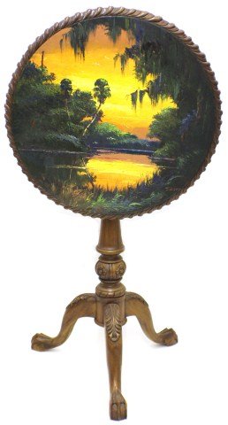 JAMES GIBSON - HIGHWAYMEN PAINTING LANDSCAPE ON TABLE: JAMES GIBSON - HIGHWAYMEN PAINTING OIL ON TABLE LANDSCAPE James Gibson (American, b.1938). Oil painting done on a tilt top occasional table. Features a sunset on a Florida lagoon landscape. A rather u