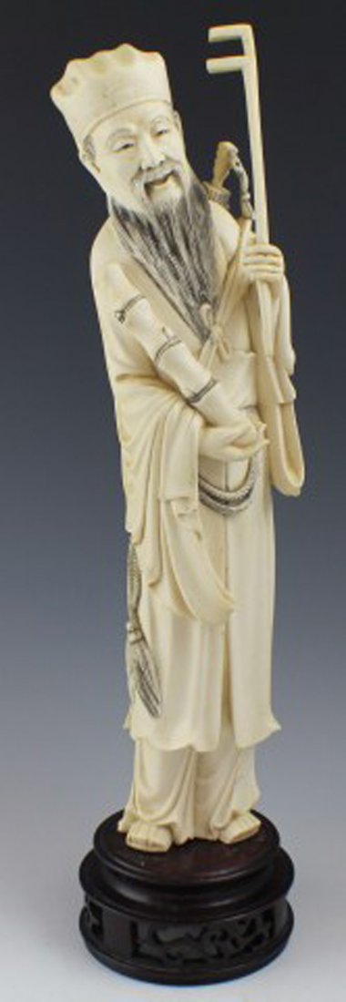CARVED IVORY FIGURE OF THE IMMORTAL CHANG KUO-LAO: CARVED IVORY FIGURE OF THE IMMORTAL CHANG KUO-LAO Carved Ivory Figure of the Taoist Xian figure Chang Kuo-Lao, The Magician, one of the eight Tao Immortals. Very detailed carving of subject carrying a