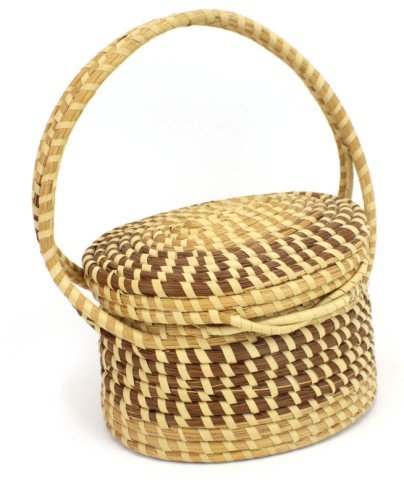 LIDDED STRAW COILED BASKET WITH HANDLE: LIDDED STRAW COILED BASKET WITH HANDLE Native American straw coiled basket, 7" diameter, lid is attached. 11 1/2" tall with handle. No signature. Size: 11 1/2" tall, 7" diameter
