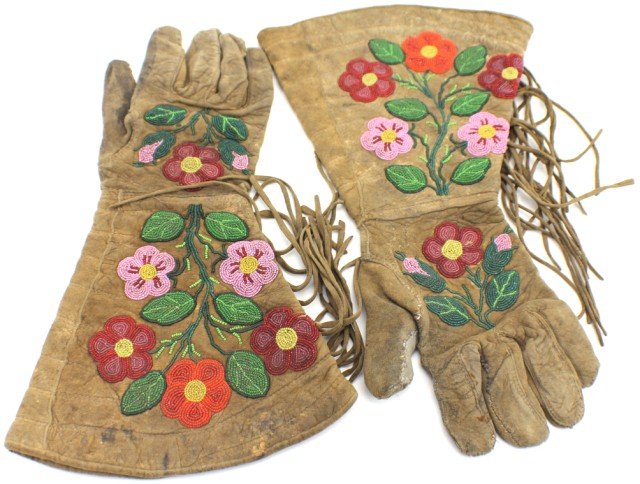 NATIVE AMERICAN BEADED FLORAL GAUNTLETS: NATIVE AMERICAN BEADED FLORAL GAUNTLETS Handmade beaded Native American gauntlets of floral design. Beads are fairly small and the beadwork is consistently intricate. Vibrant pinks, reds and oranges e