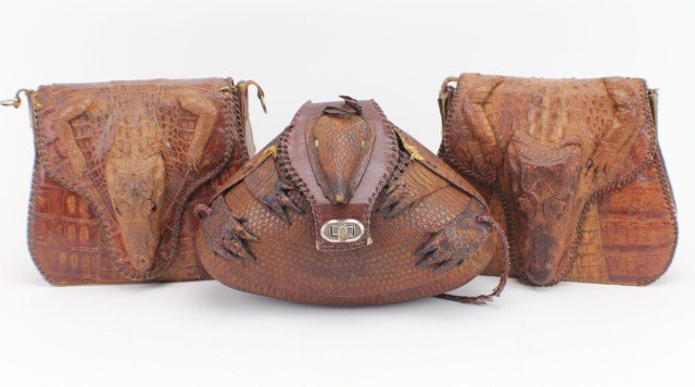 GROUP OF THREE ANIMAL PURSES: GROUP OF THREE ANIMAL PURSES Group of three animal purses. Armadillo Purse measures 8 x 11", with strap. Age appropriate wear, strap is unraveling in places. Cuban 1950's Alligator Purse measures 8 x 