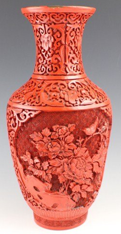 LARGE CHINESE CINNABAR LACQUERED BALUSTER VASE: LARGE CHINESE CINNABAR LACQUERED BALUSTER VASE Chinese Cinnabar lacquered vase. Baluster form. Having 2 decorated panels of primarily floral motif throughout. Flared rim. Size: 12 3/4"