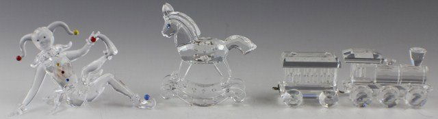 4 SWAROVSKI CRYSTAL FIGURES - TRAIN JESTER HORSE: 4 SWAROVSKI CRYSTAL FIGURES - TRAIN JESTER HORSE 4 retired Swarovski Crystal figures. Rocking Horse #183270, Train Locomotive #015145, and Train Wagon/Carriage #015150 from the When We Were Young them