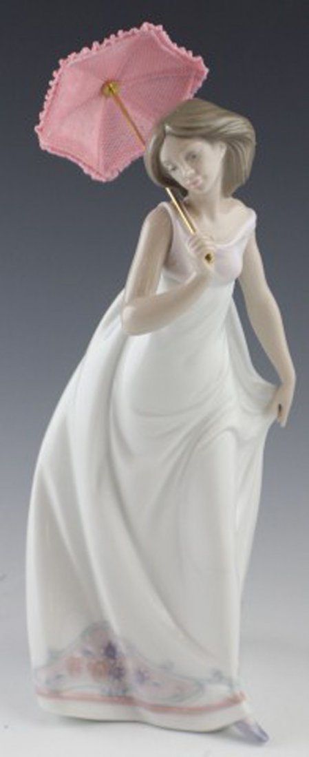 LLADRO FIGURE - #7636 AFTERNOON PROMENADE: LLADRO FIGURE - #7636 AFTERNOON PROMENADE 01007636 AFTERNOON PROMENADE. Issue Year: 1995. Retirement Year: 1998. Sculptor: José Puche. Figure comes in original box with paracol. Size: 11''