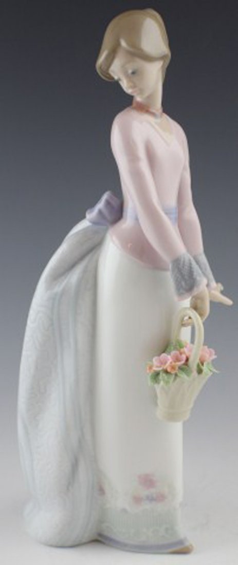LLADRO PORCELAIN FIGURE - #7622 BASKET OF LOVE: LLADRO PORCELAIN FIGURE - #7622 BASKET OF LOVE 01007622 BASKET OF LOVE. Issue Year: 1994. Retirement Year: 1996. Sculptor: José Puche. Figure comes in original box. Size: 9.75''