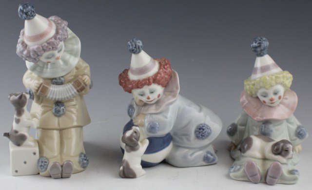 THREE LLADRO PORCELAIN FIGURES - #5277, 5277, 5279: THREE LLADRO PORCELAIN FIGURES - #5277, 5277, 5279 01005278 PIERROT WITH PUPPY & BALL. Issue Year: 1985. Retirement Year: 1992. Sculptor: José Puche. 01005279 PIERROT WITH CONCERTINA. Issue Year: 198