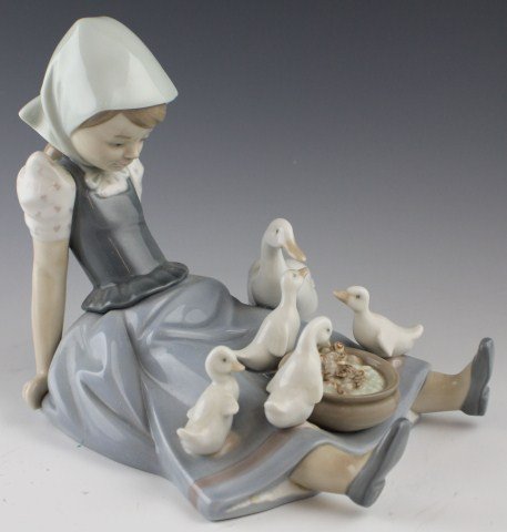 LLADRO FIGURE - #5074 GIRL, SAUCEPAN, AND DUCK: LLADRO FIGURE - #5074 GIRL, SAUCEPAN, AND DUCK 01005074 GIRL, SAUCEPAN AND DUCK. Issue Year: 1980. Retirement Year: 1992. Sculptor: Juan Huerta. Figure comes in original box. Size: 6.75''