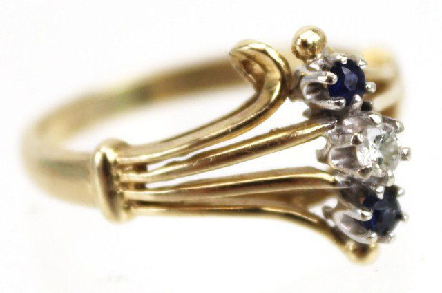 14K YELLOW GOLD LADIES SAPPHIRE AND DIAMOND RING: 14K YELLOW GOLD LADIES SAPPHIRE AND DIAMOND RING Ladies 14K yellow gold vintage ring with .05 ct. diamond and 2 .02 ct. sapphires. Size: 6 Weight: 3.1g