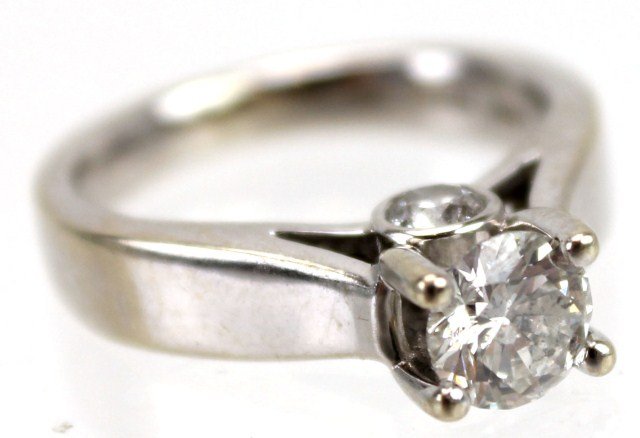 14K WHITE GOLD DIAMOND ENGAGEMENT RING: 14K WHITE GOLD DIAMOND ENGAGEMENT RING 0.67 ct round brilliant cut diamond of I-1 clarity and F color. In a solitaire style setting accented by 2 diamonds of 0.13 to 0.14 ct each, I-1 clarity, and F c