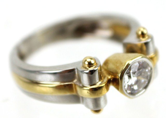 18K TWO TONE DIAMOND SOLITAIRE ENGAGEMENT RING: 18K TWO TONE DIAMOND SOLITAIRE ENGAGEMENT RING Approximately a 0.5 ct diamond set in a Cartier style 18K two tone solitaire setting. Diamond is approximately SI clarity and H color. Size: 5.5 Weight: