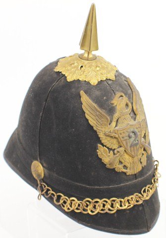 MODEL 1881 US SPIKED DRESS HELMET: MODEL 1881 US SPIKED DRESS HELMET Original calvary enlisted helmet. Brass spike protrudes from oak leaf decorative mount. A brass eagle with crossed rifles and a 2nd regiment shield is attached to fro