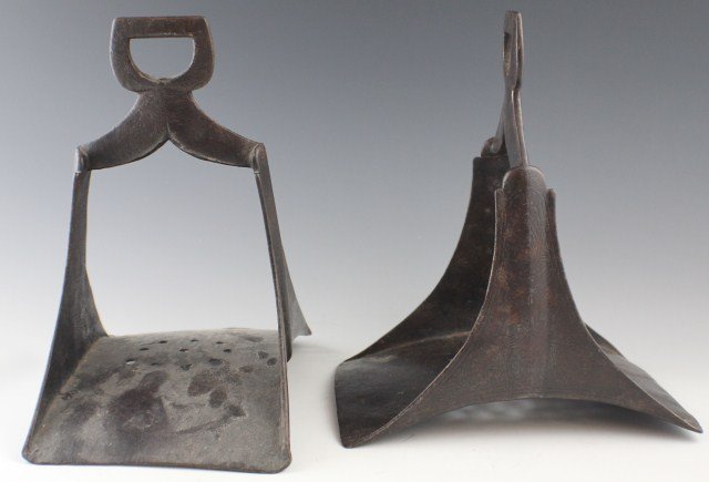 OTTOMAN EMPIRE HORSE RIDING STIRRUPS: OTTOMAN EMPIRE HORSE RIDING STIRRUPS A miss-matched pair of circa 18th century cast iron stirrups. Very similar in size and design but not a pair. One is decorated with swirl patterns and has more bas