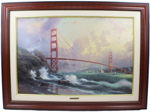 THOMAS KINKADE GOLDEN GATE BRIDGE: THOMAS KINKADE GOLDEN GATE BRIDGE Thomas Kinkade (American, 1958 - 2012). #3175 of 3950 "Limited Offset edition", on premium artist canvas, hand signed by the artist. Framed in brown and linen frame w