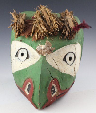 ALASKAN TOTEM POLE TOP BIRDS HEAD W / PHOTOGRAPH: ALASKAN TOTEM POLE TOP BIRDS HEAD W / PHOTOGRAPH A 19th century birds head section from the top of a Totem Pole. Accompanying it is a photograph of the original Totem Pole taken in Wrangell, Alaska. P