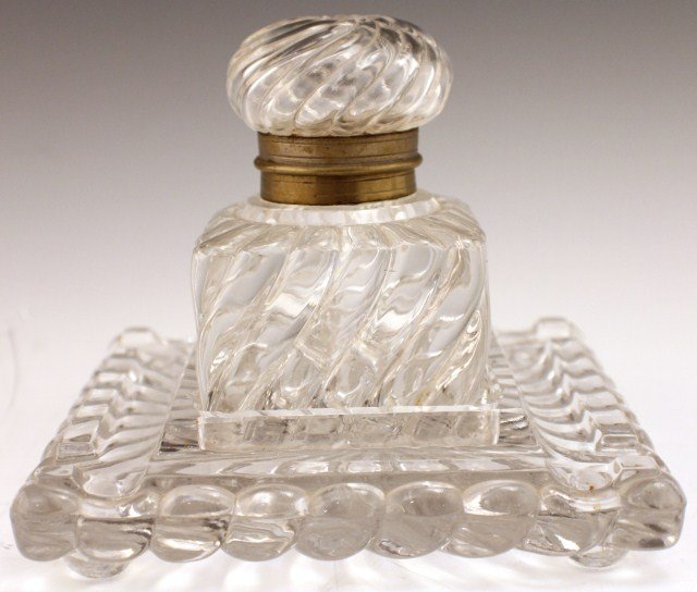 19TH CENTURY PRESSED GLASS TABLE-TOP INKWELL: 19TH CENTURY PRESSED GLASS TABLE-TOP INKWELL Late 19th century Art glass inkwell with blown glass top and brass cap hinge. The top and drip tray are matching (glass chip to the drip tray). Consignor s