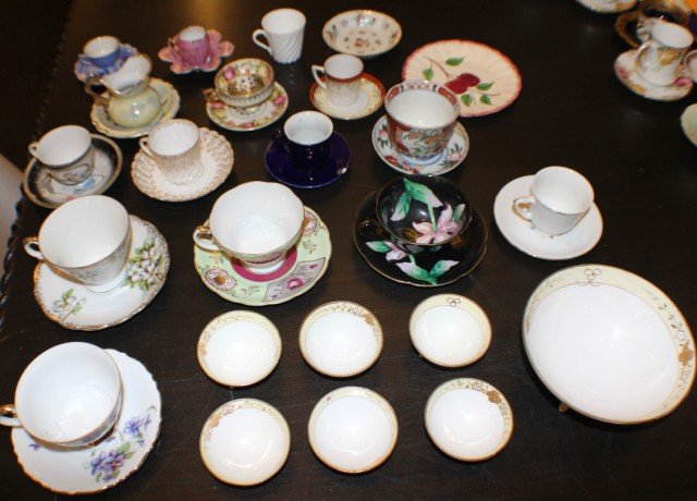 LOT OF JAPANESE CHINA PIECES & PART SETS: LOT OF JAPANESE CHINA PIECES & PART SETS This set features 13 teacup and saucer sets. 1 pitcher and saucer set. 1 white tea cup. 1 floral dish. 1 saucer with cherry design. 1 large bowl and 6 matching