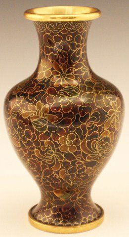 EARLY 20TH CENTURY CHINESE CLOISONNE VASE: EARLY 20TH CENTURY CHINESE CLOISONNE VASE Copper base metal vase with a mix of brown and green enamels, the pattern is of flowers in surealist fashion. Size: 7" tall