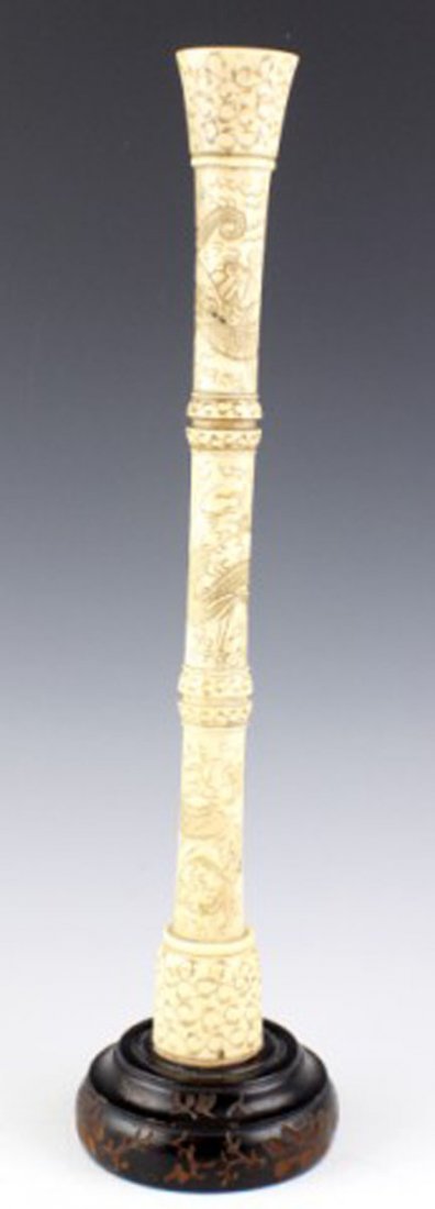 ANTIQUE BONE CHINESE PUZZLE BALL STAND: ANTIQUE BONE CHINESE PUZZLE BALL STAND A three piece carved bone column with cone top finnial. Standing to a carved wood base. Size: 14.5" total