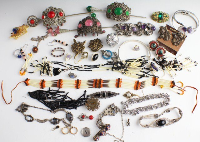 40+ MIXED COSTUME JEWELRY: 40+ MIXED COSTUME JEWELRY Over 40 pieces of jewelry including; bracelets, 3 stick ponytail holders, rings, button covers, necklaces, and brooches. 14K GF heart earring and necklace set, Native America