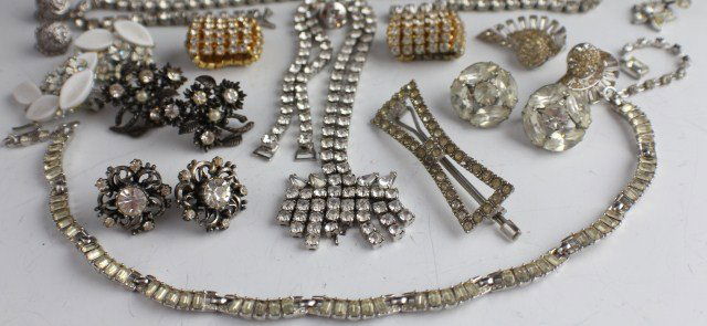 VINTAGE RHINESTONE COSTUME JEWELRY LOT: VINTAGE RHINESTONE COSTUME JEWELRY LOT Rhinestone costume jewelry. 5 pairs of clip on and screw back earrings. A solitaire pin. Hair clip. 8" bracelet. 2 necklaces of various lengths. A Coro pair of s