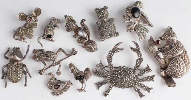 LOT 11 VINTAGE STERLING MARCASITE ANIMAL BROOCHES: LOT 11 VINTAGE STERLING MARCASITE ANIMAL BROOCHES 11 sterling silver and marcasite brooch pins. A koala with a reddish-orange stone, a crab, a frog, a beetle, a bear, a squirrel, a rooster with onyx s