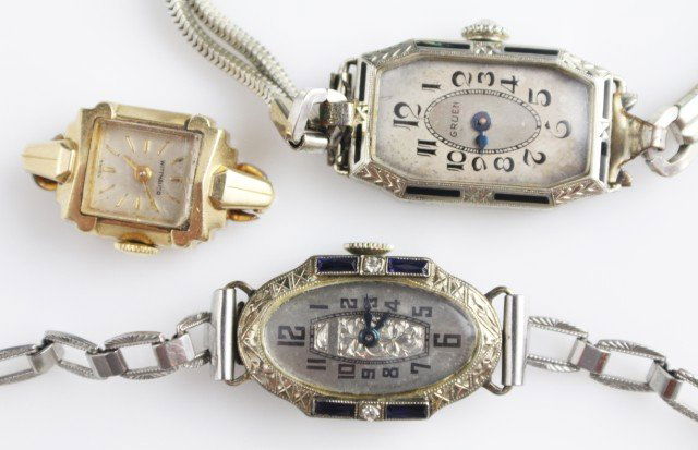 LOT OF THREE VINTAGE LADIES WATCHES: LOT OF THREE VINTAGE LADIES WATCHES Lot includes a Wittnauer watch 14K gold case 17 Jewel movement, a Gruen watch 14K gold case reinforced with metal 15 Jewel movement and a Loper watch in an 18K gold
